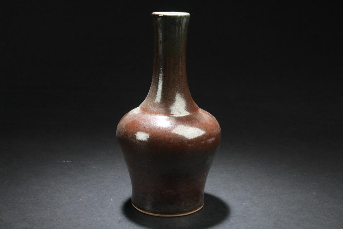Chinese Porcelain Vase: Of broad shoulders and rising to a tall neck, the Porcelain Vase is covered overall with fine crackled finishes. Height: 7.5 "