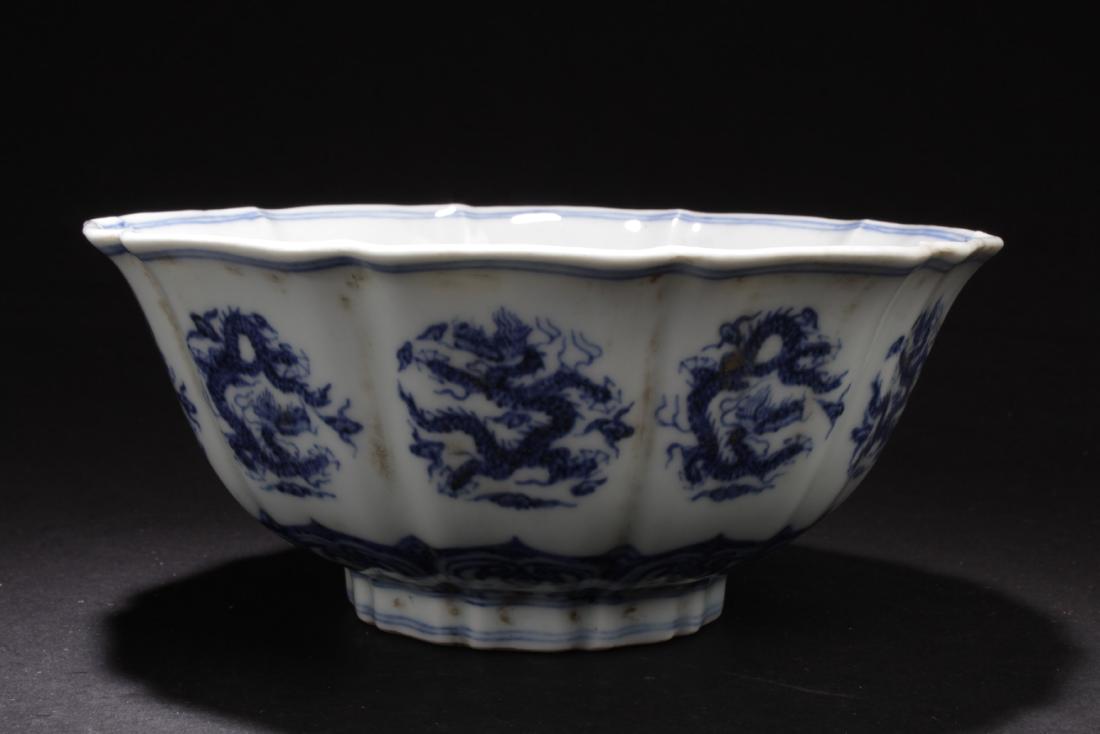 An Estate Chinese Blue and White Windowed: An Estate Chinese Blue and White Windowed Dragon-decorating Porcelain Cup Display. Height: 3.25 (inch). Opening Diameter: 7 (inch).