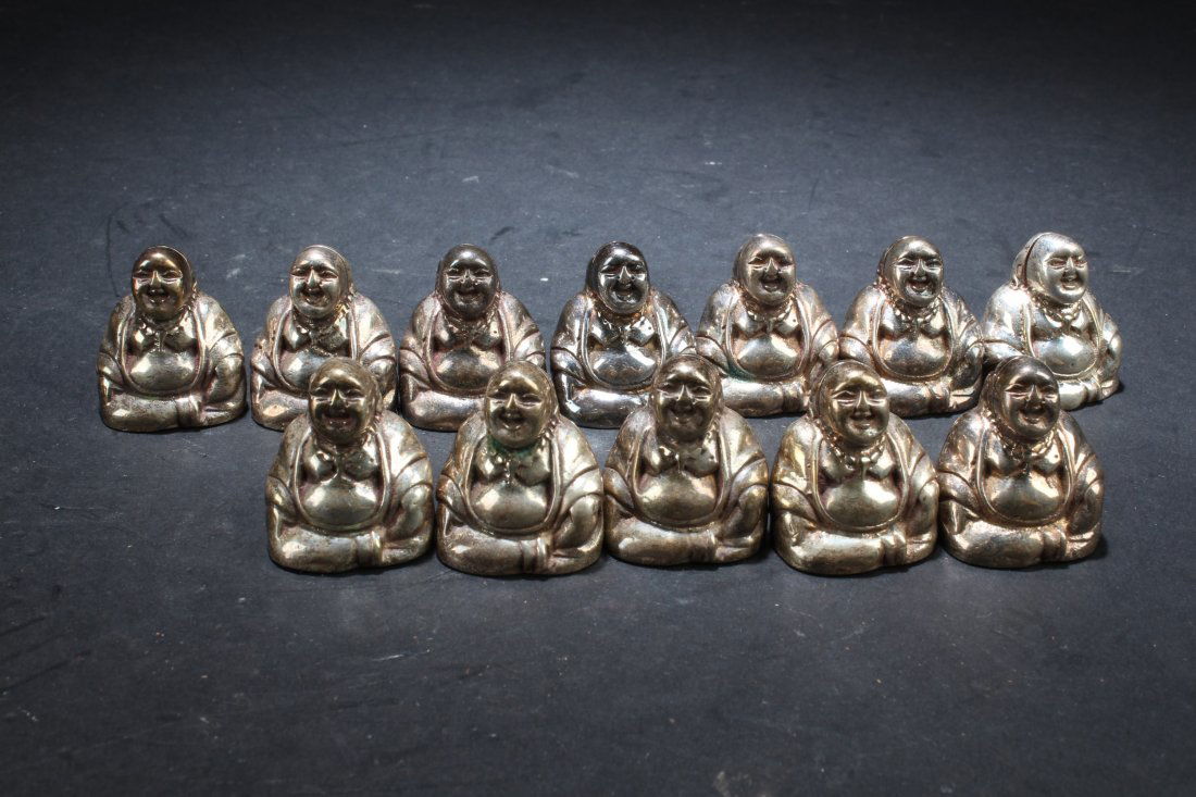A Collection of Twelve Antique Chinese Silver Buddha St (1 of 7)