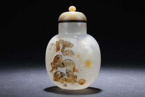 Chinese Agate Snuff Bottle: Chinese agate snuff bottle, round stopper with black trim, white round body with darkened decoration of two horses playing underneath a large tree. Height: 3"