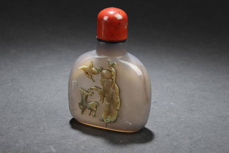 Chinese Amber Snuff Bottle: Chinese Amber Snuff Bottle, depicting a deity with an animal and a bird. Height: 3.25"