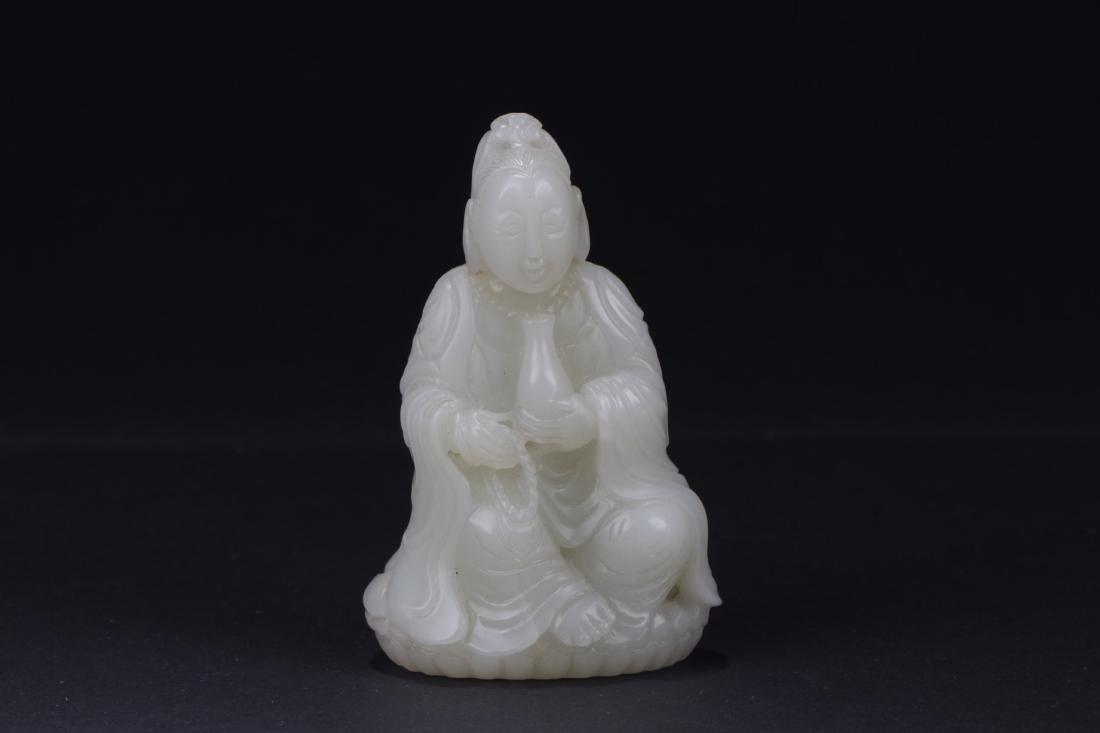 Chinese Jade Figurine: Chinese Jade figurine, simplistic carving of a seated female figure wearing loose robes and holding a medicine urn in creamy white jade. Length 2 in Height 3.25 in