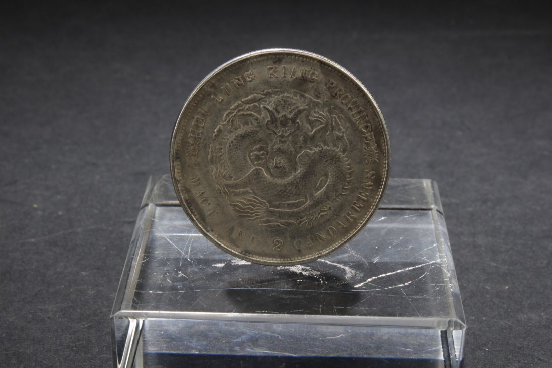 Chinese Coin: Chinese Coin, depicting dragon with the wording Hei Lung Kiang province. Diameter: 1.5"