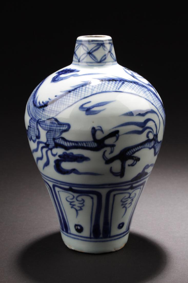 Chinese Blue & White Meiping Vase: Of broad shoulders, the porcelain vase is decorated with dragons surrounded by scrolling clouds. Height: 6.5 "