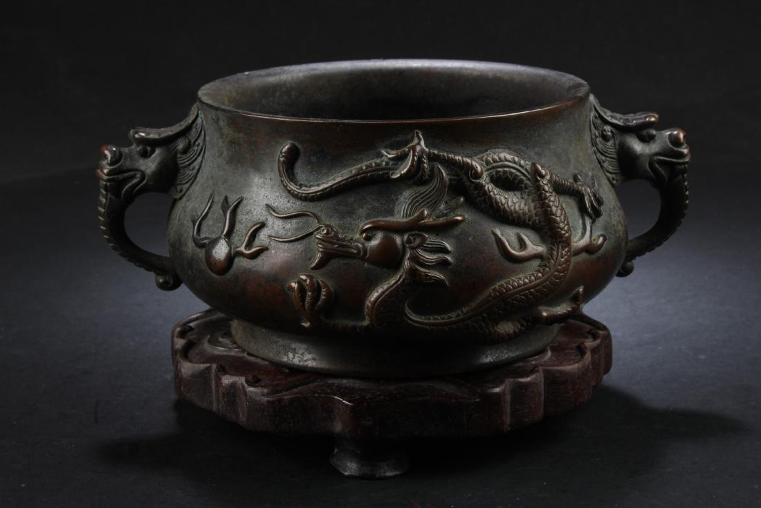 BRONZE CAST 'DRAGONS' CENSER WITH WOODEN STAND (1 of 2)
