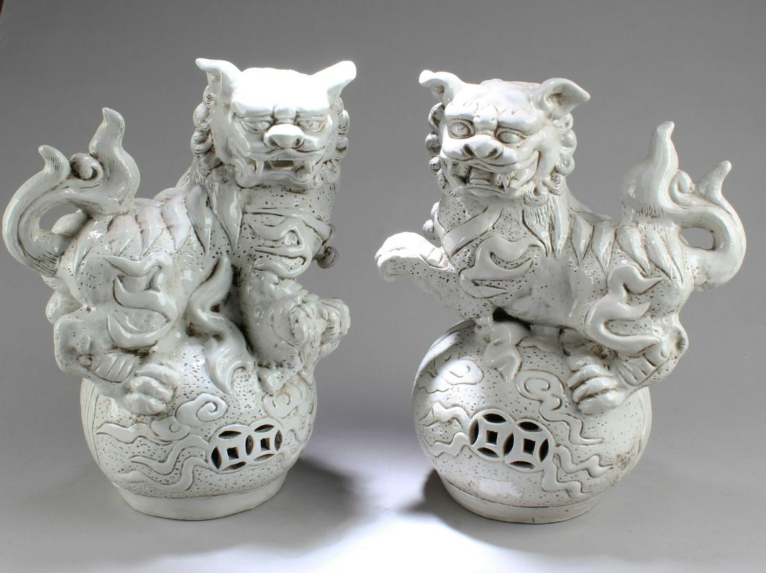 A Pair of Chinese Blanc De Chine Foo Dogs Display (1 of 2)