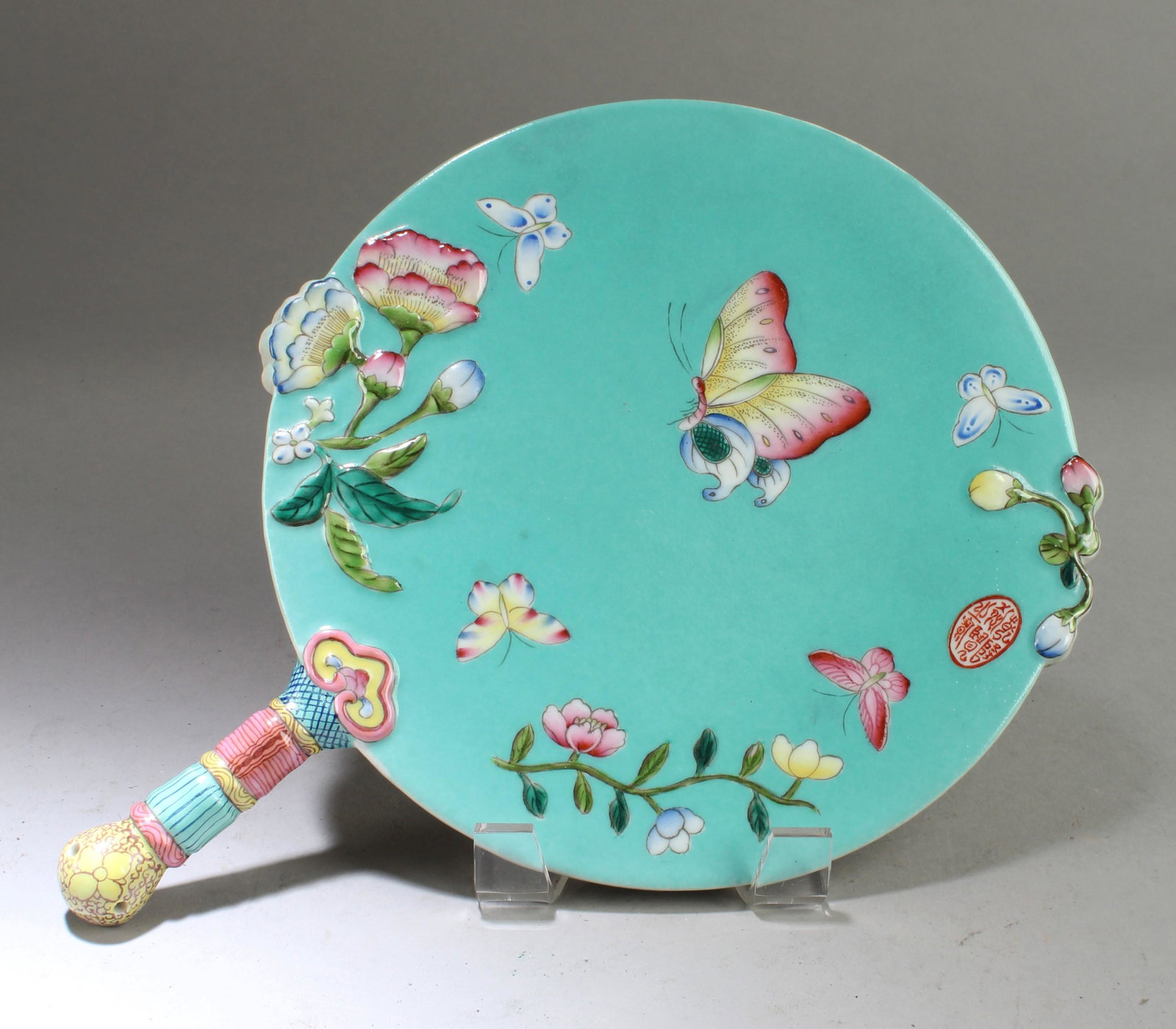 A Round Mirror Shaped Porcelain Ornament: A Round Mirror Shaped Porcelain Ornament. Length: 11.5"
