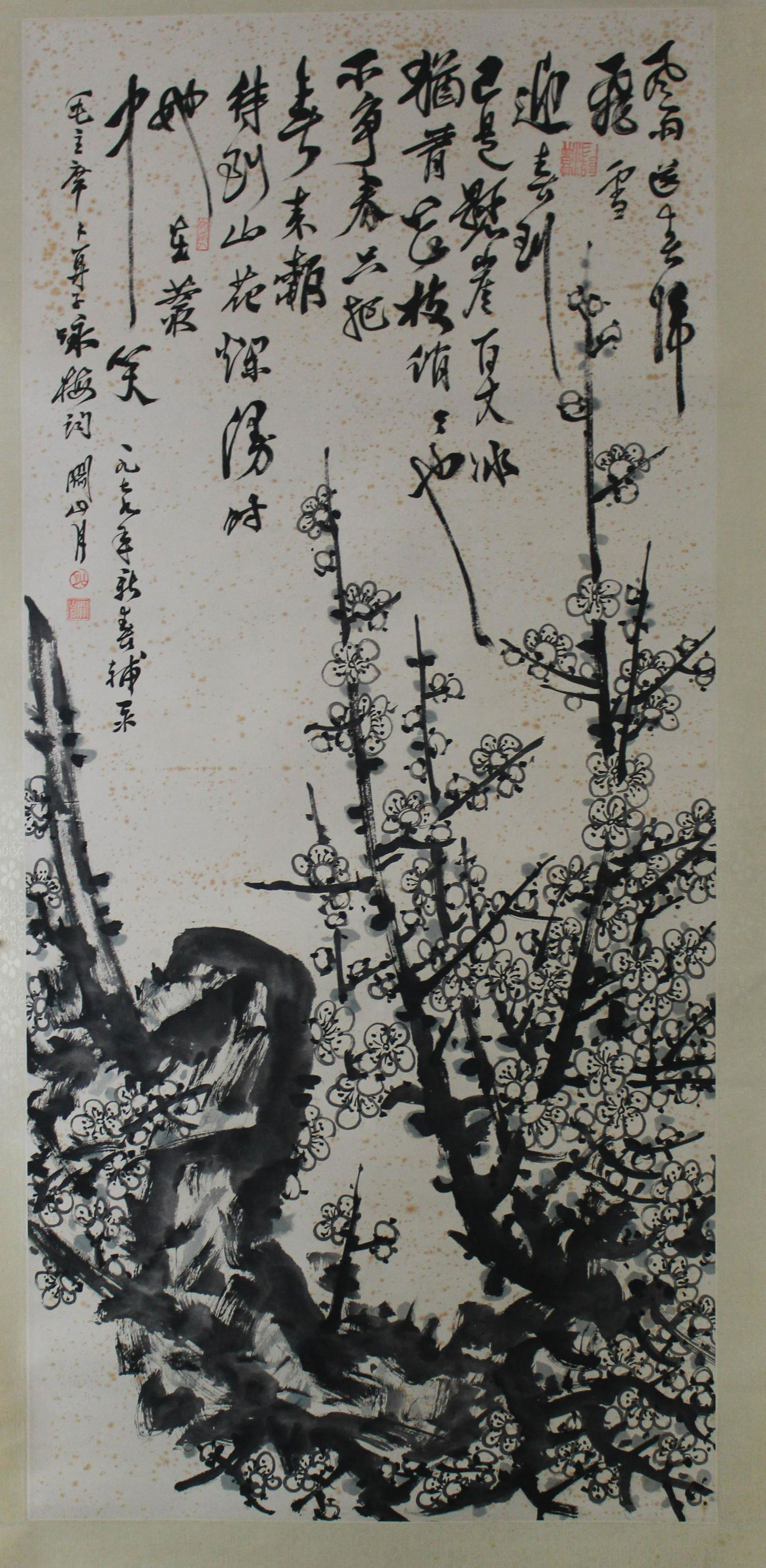 Chinese Hanging Scroll Painting: Ink on paper, depicting plum flowers, signed with seal attributed to Guan Shan Yue. Length: 19" Height: 41.75"