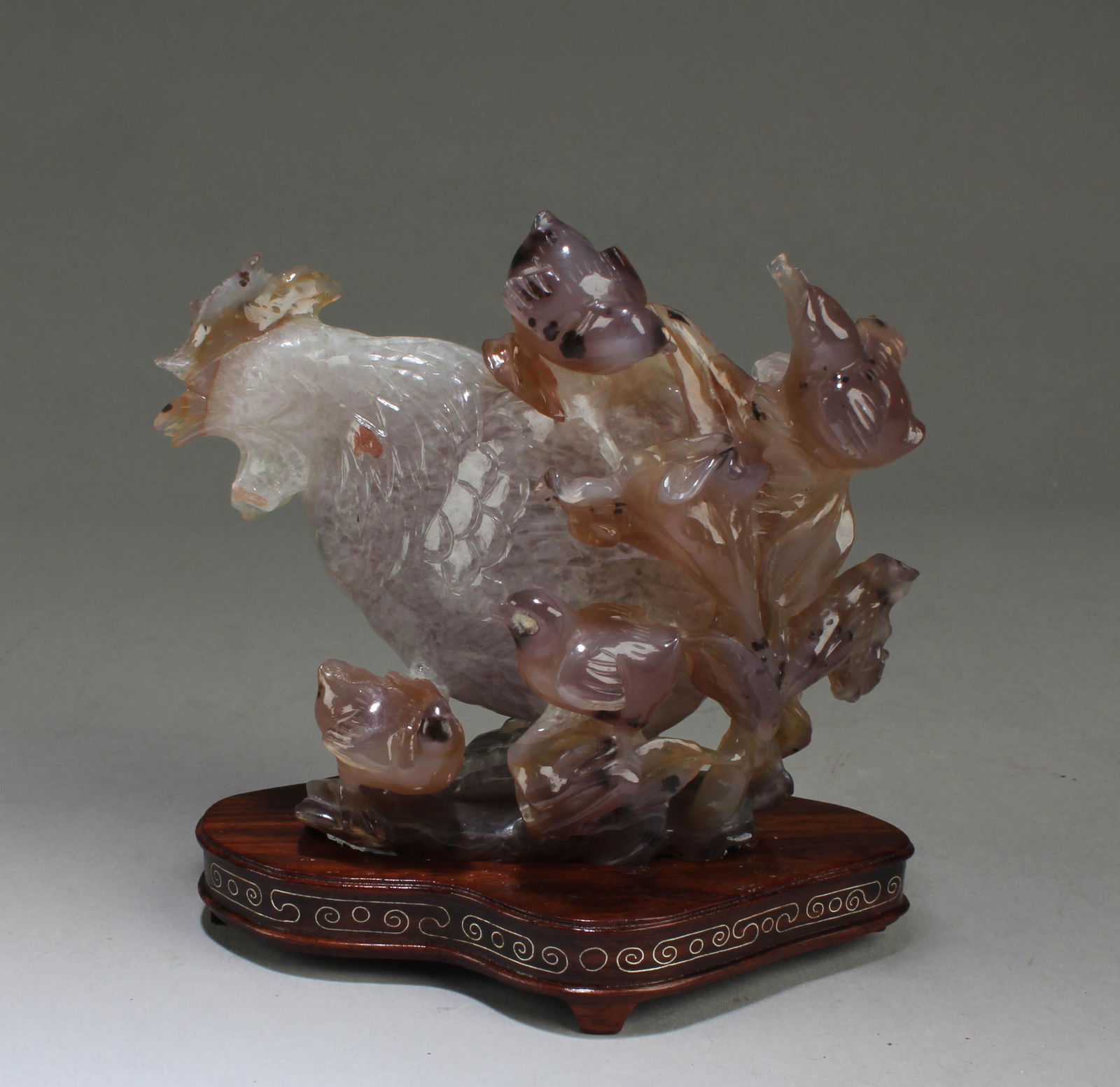 A Carved Hen Figurine (1 of 6)