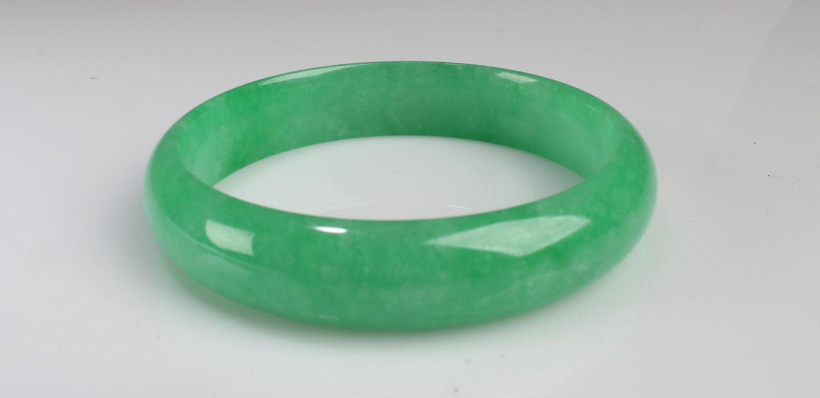 A Jadeite Like Bangle: A Jadeite Like Bangle. Inner Diameter: 2"
