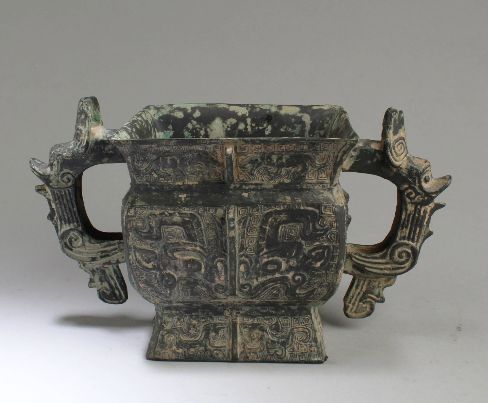 A Bronze Censer: A Bronze Censer, flanked by twin handles. Height: 5.75"