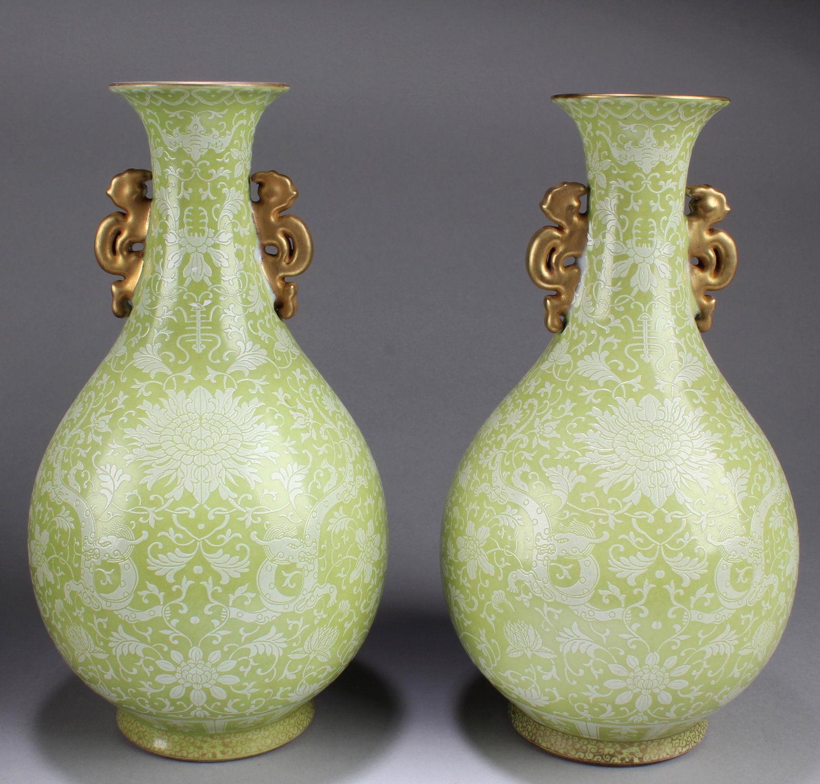 Chinese Famille Verte Porcelain Vase: Chinese Famille Verte Porcelain Vase, flanked by twin handles, decorated with dragon and auspicious bats. 'QianLong' mark at base. Height: 12.25"
