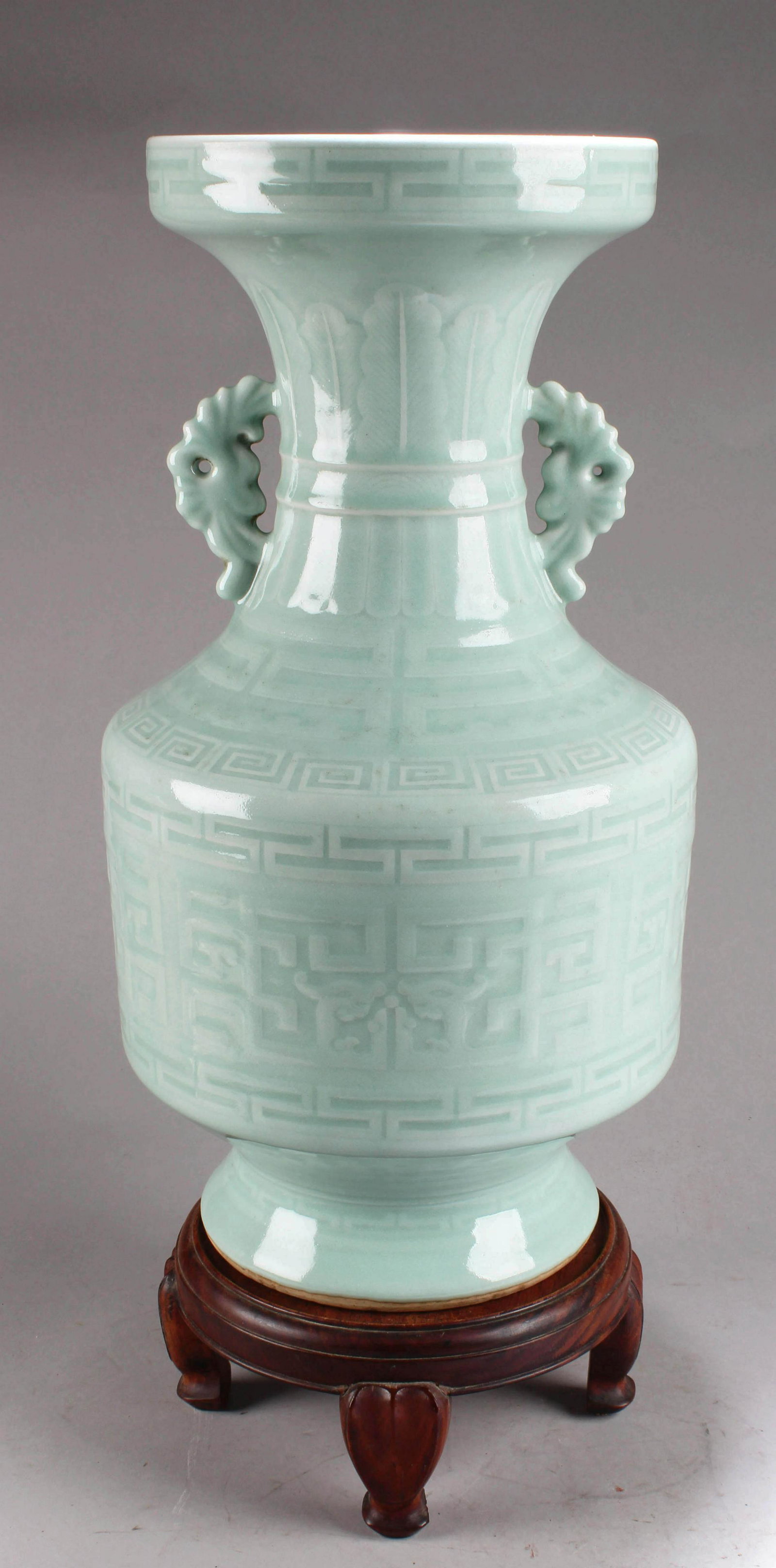 Chinese Porcelain Vase with Twin Handles: Chinese Porcelain Vase with Twin Handles. Comes fitted with a wooden stand. Height: 19.5"