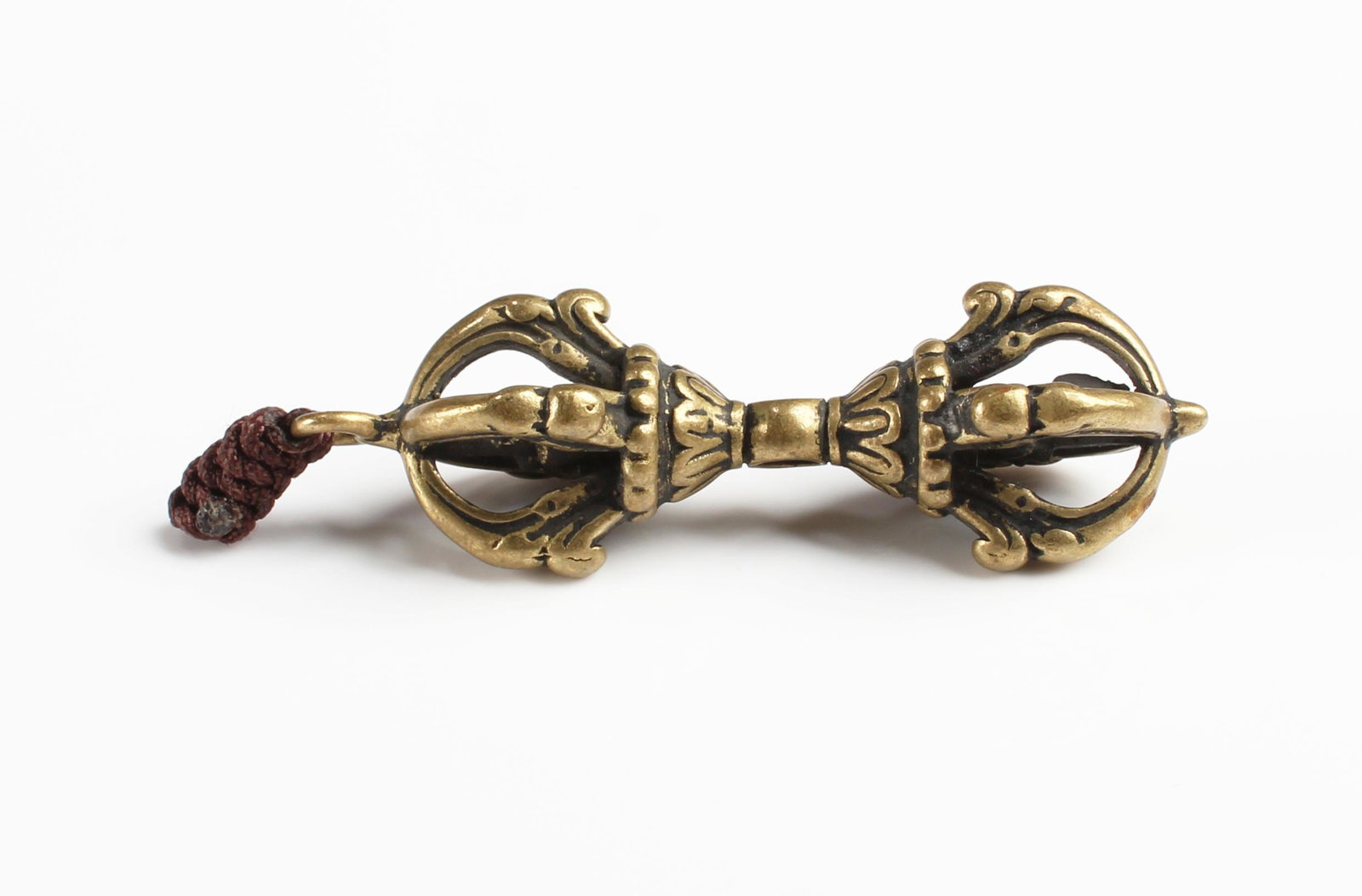 A Tibetan Religious Instrument: A Tibetan Religious Instrument. Length: 1.75"