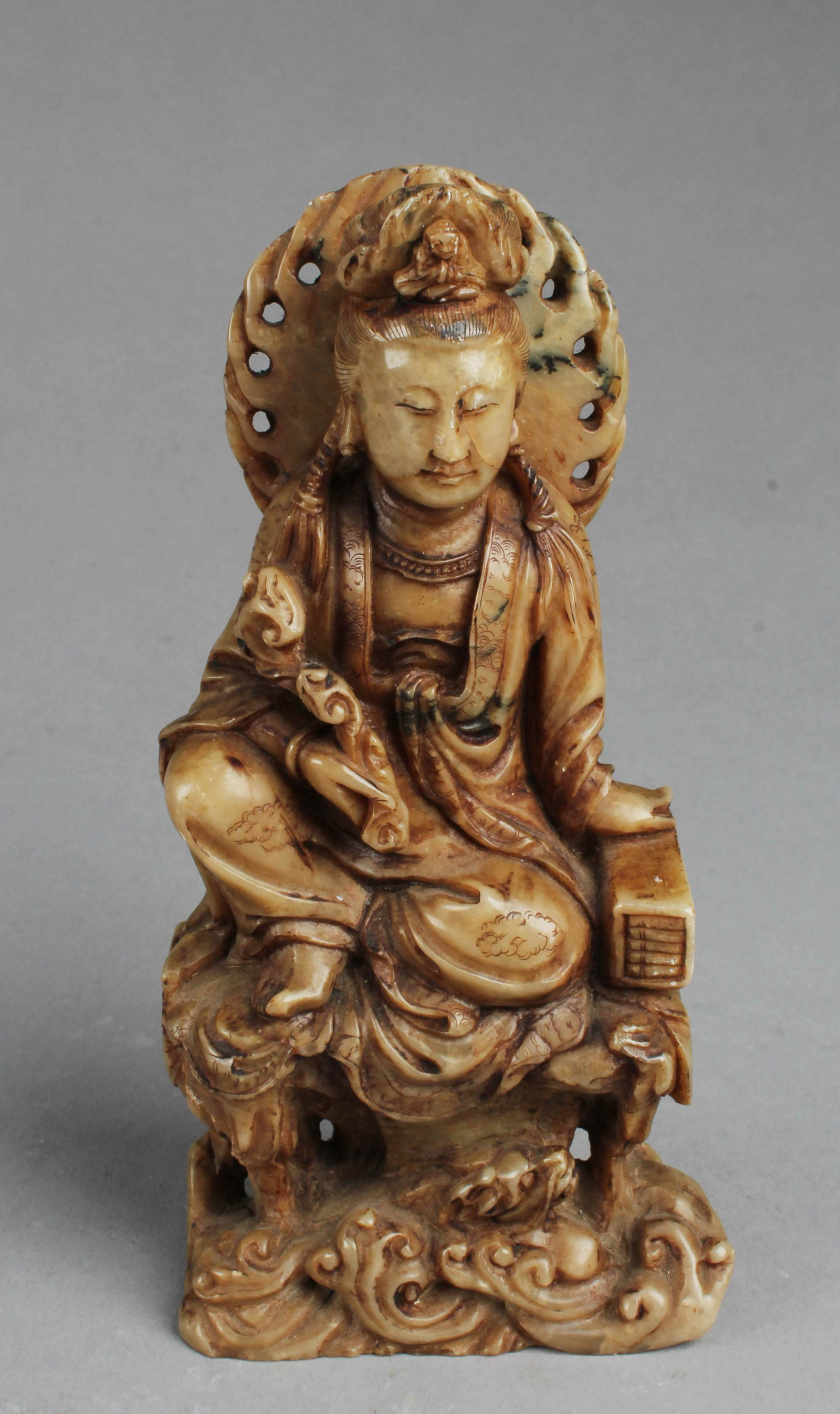 A Carved Soapstone Guanyin Statue: A Carved Soapstone Guanyin Statue. Height: 6.1"