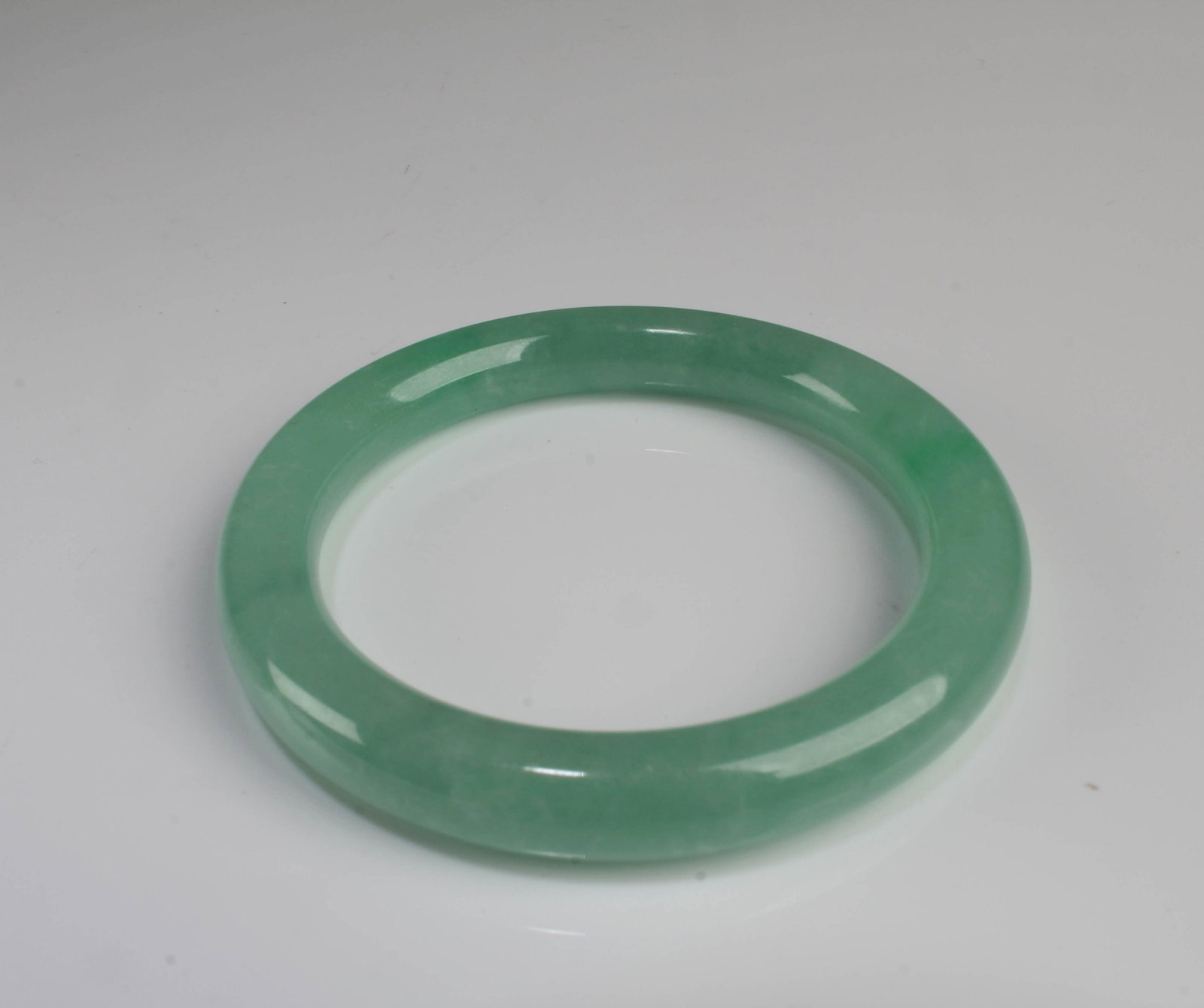 A Jadeite Like Bangle: A Jadeite Like Bangle. Inner Diameter: 2"