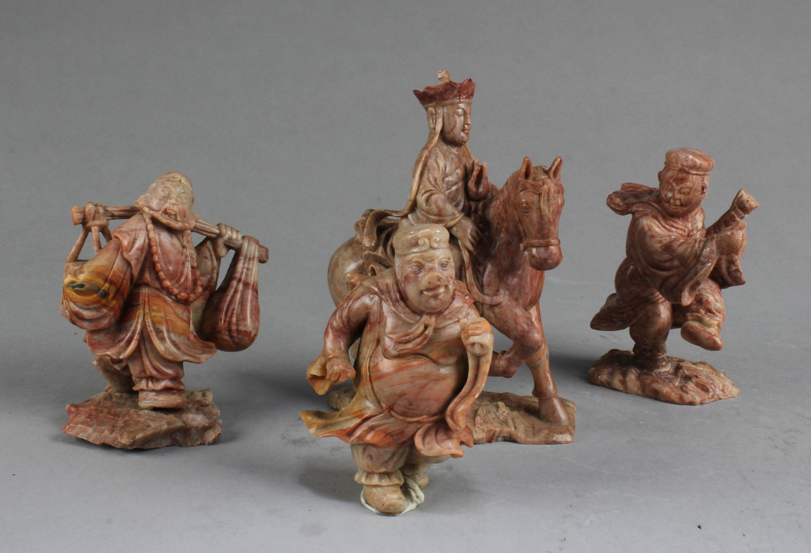 A Group of Four Carved Soapstone Figurine (1 of 4)