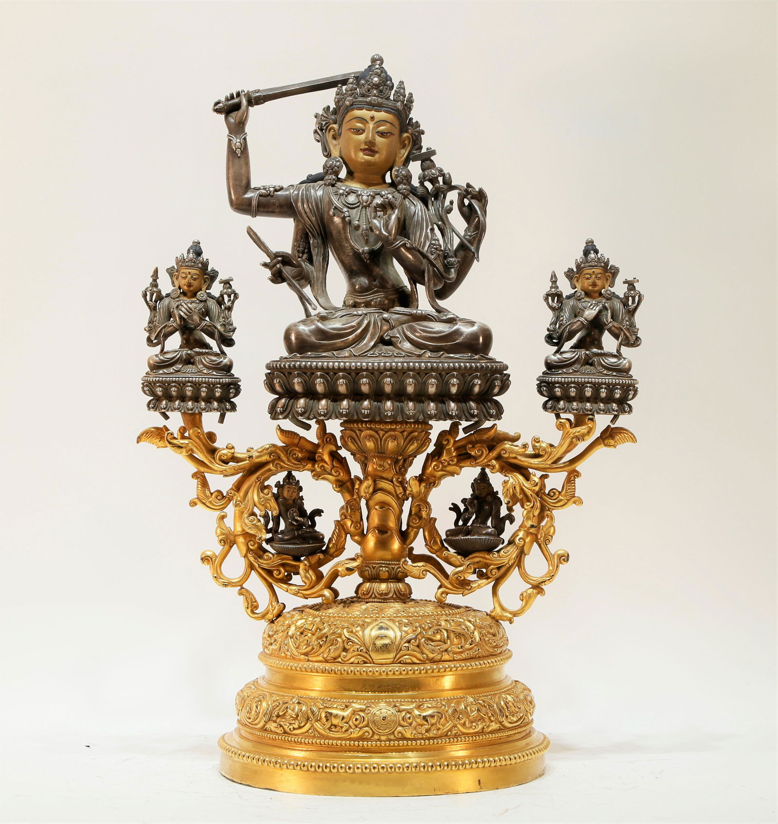 A silver gilt-bronze Tibetan statue of Manjusri (1 of 7)