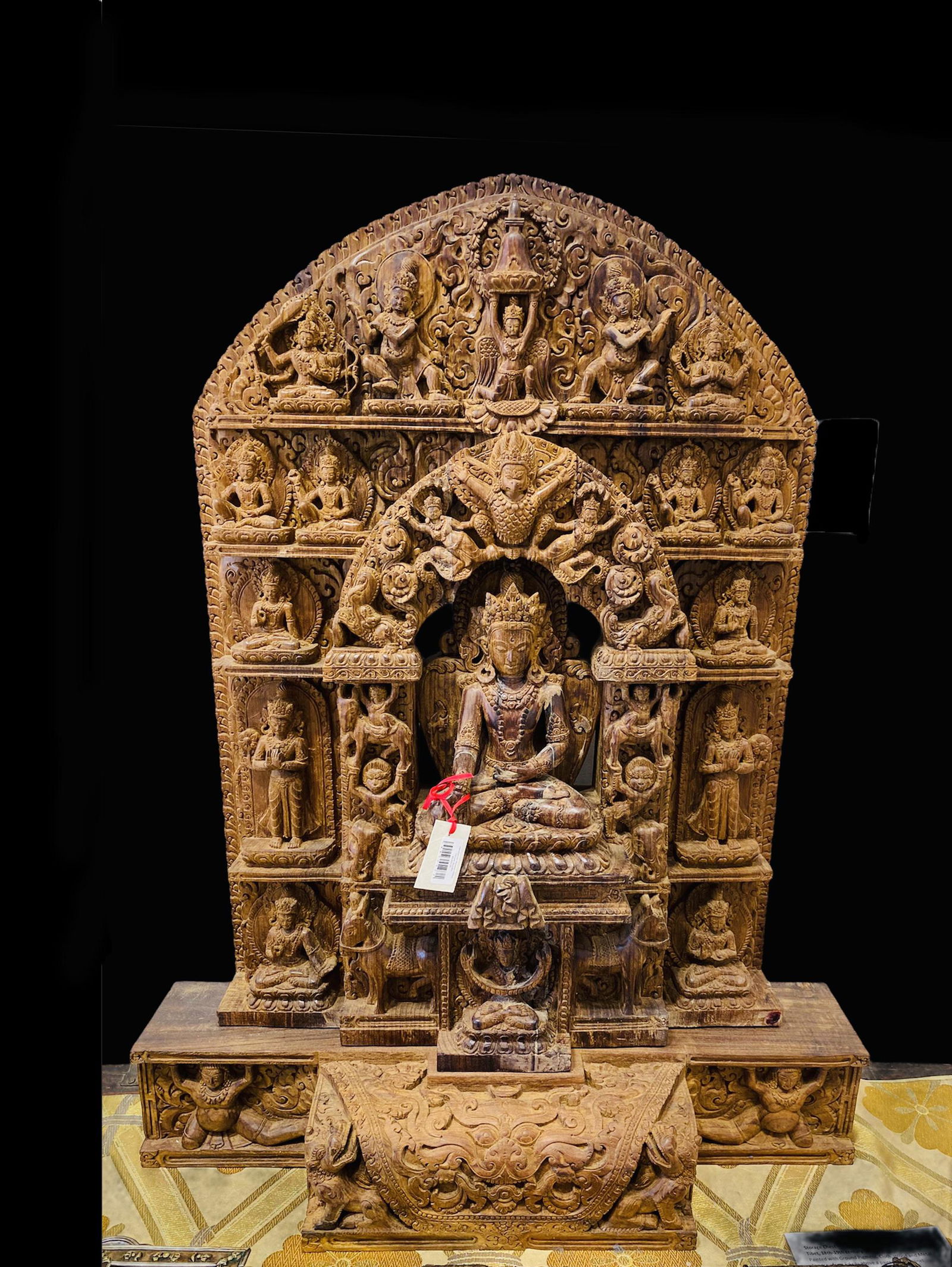 A hand carved Teak wood figure of Buddha touching earth (1 of 2)