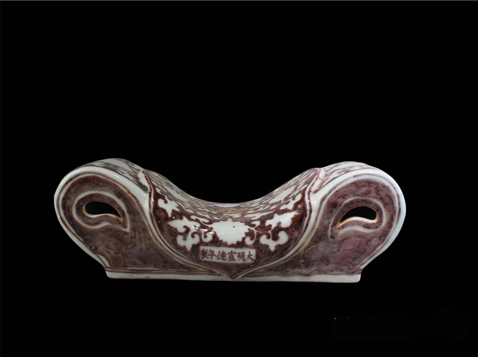 Chinese Iron Red Porcelain Pillow: Chinese Iron Red Porcelain Pillow. 'XuanDe' mark. Length: 11.25" Width: 5"Height: 3"