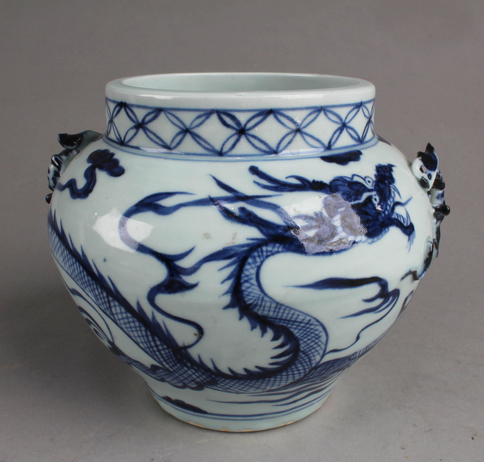 Chinese Blue & White Porcelain Jar: Chinese Blue & White Porcelain Jar, depicting a dragon surrounded by scrolling clouds. Diameter: 4"