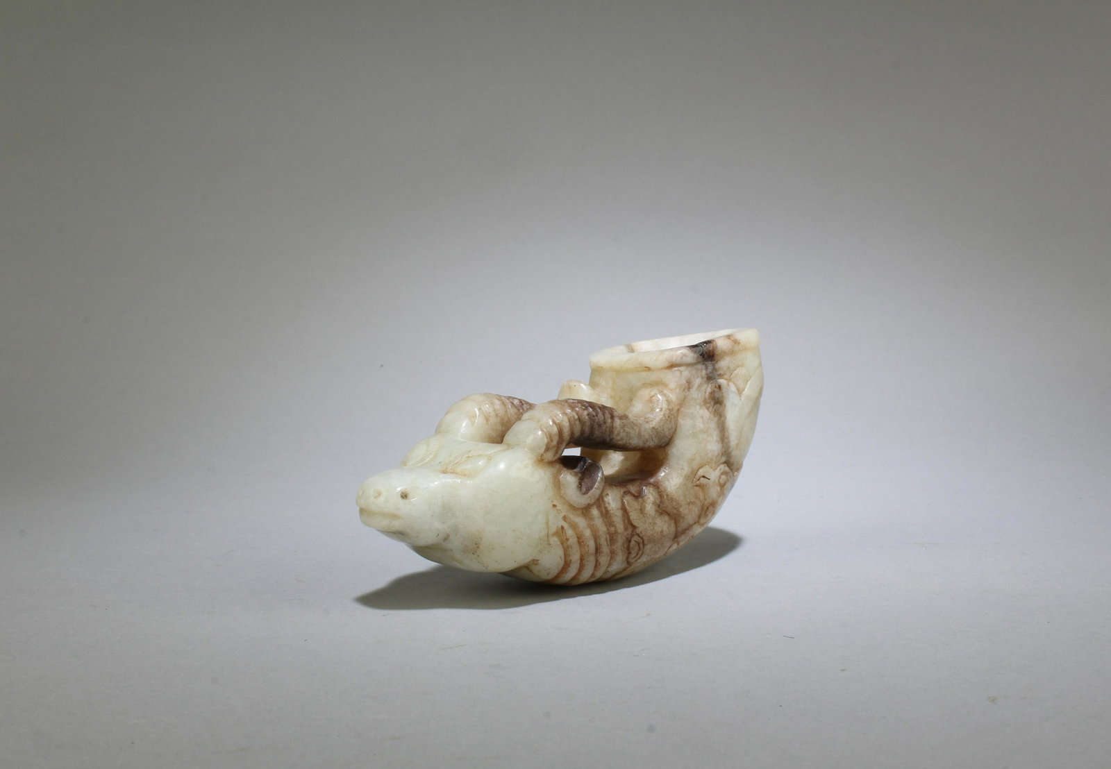 A Carved Jade Cup: A Carved Jade Cup. Length: 4"