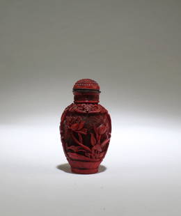 A Cinnabar Lacquer Snuff Bottle: A Cinnabar Lacquer Snuff Bottle. Height: 2.2"