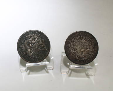 A Group of Two Chinese Silver Coins: A Group of Two Chinese Silver Coins. Diameter: 1.5"