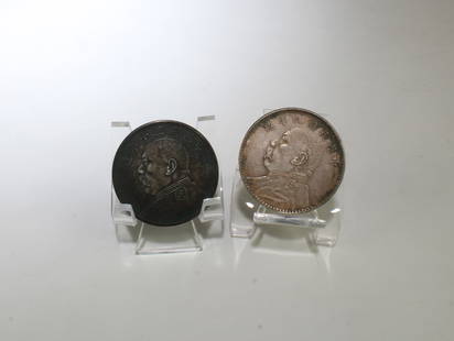 A Group of Two Chinese Silver Coins: A Group of Two Chinese Silver Coins. Diameter: 1.5"