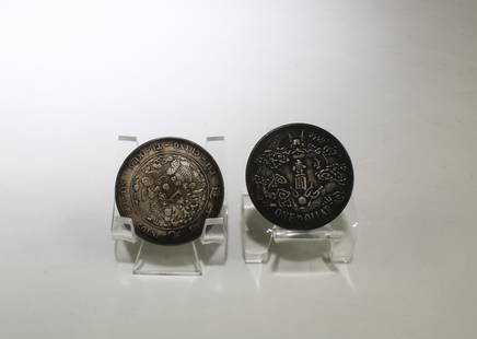 A Group of Two Chinese Silver Coins: A Group of Two Chinese Silver Coins. Diameter: 1.5"