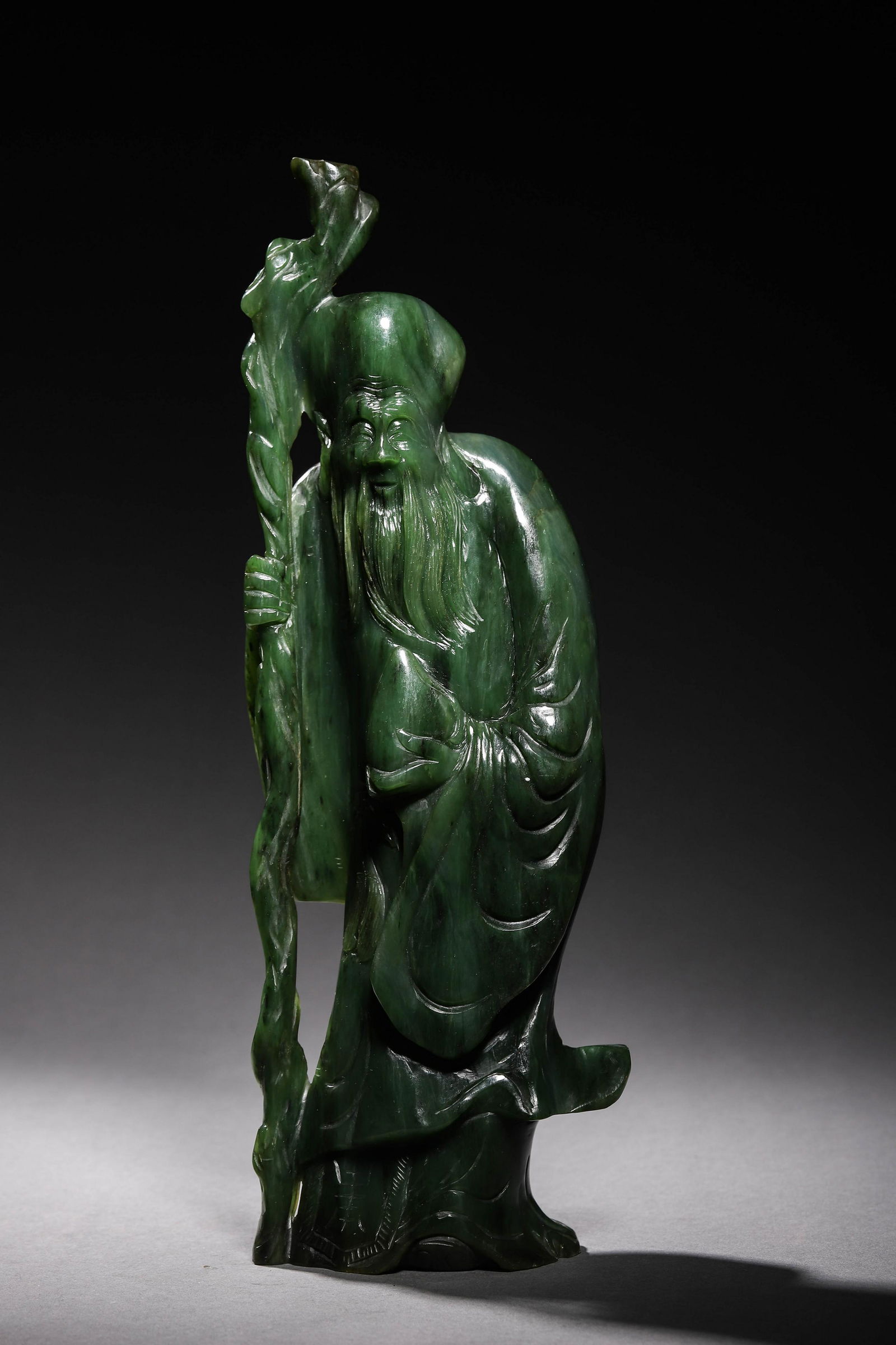 Qing: A Carved Jade Deity Figurine (1 of 8)