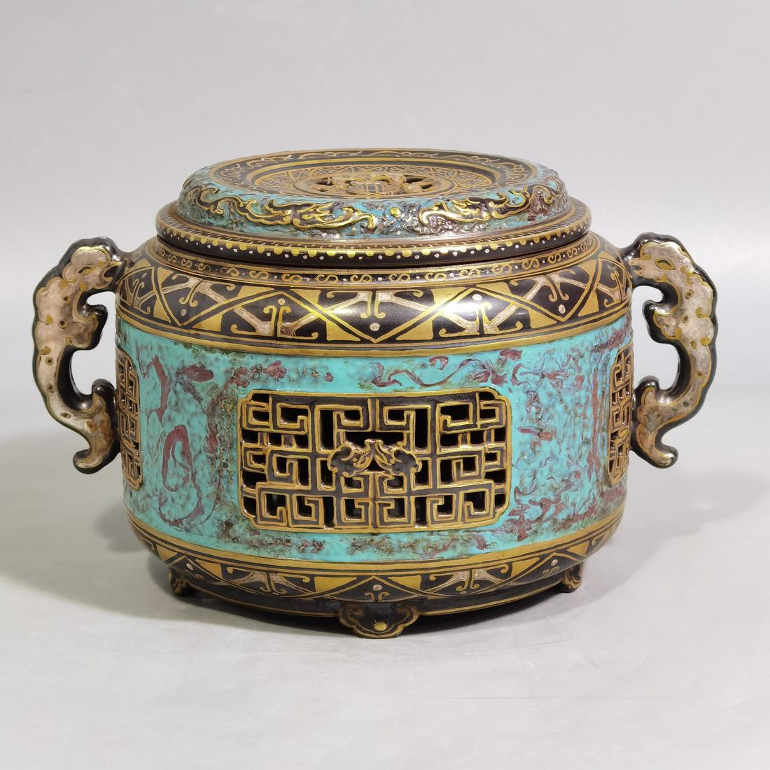 An old Bronze Color Porcelain Incense Diffuser: An old Bronze Color Porcelain Incense Diffuser. 'QianLong' mark at base. Height: 9cm Diameter: 11cm
