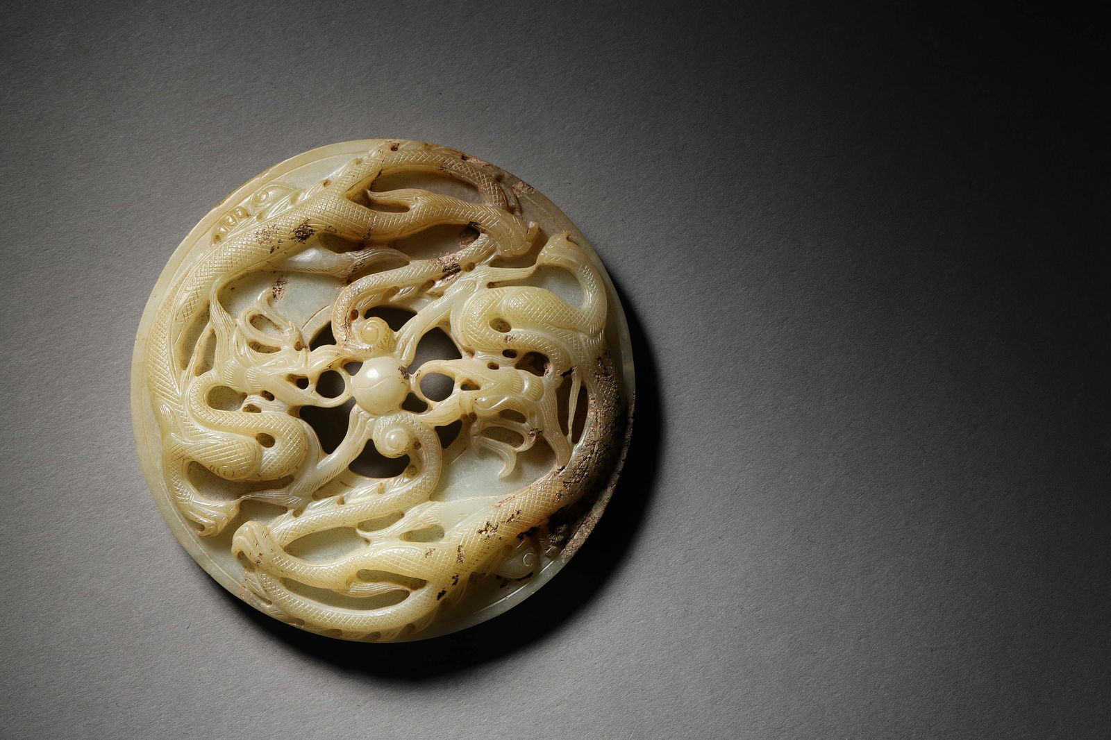 Ming: A Carved White Jade Round Dragon Ornament (1 of 8)