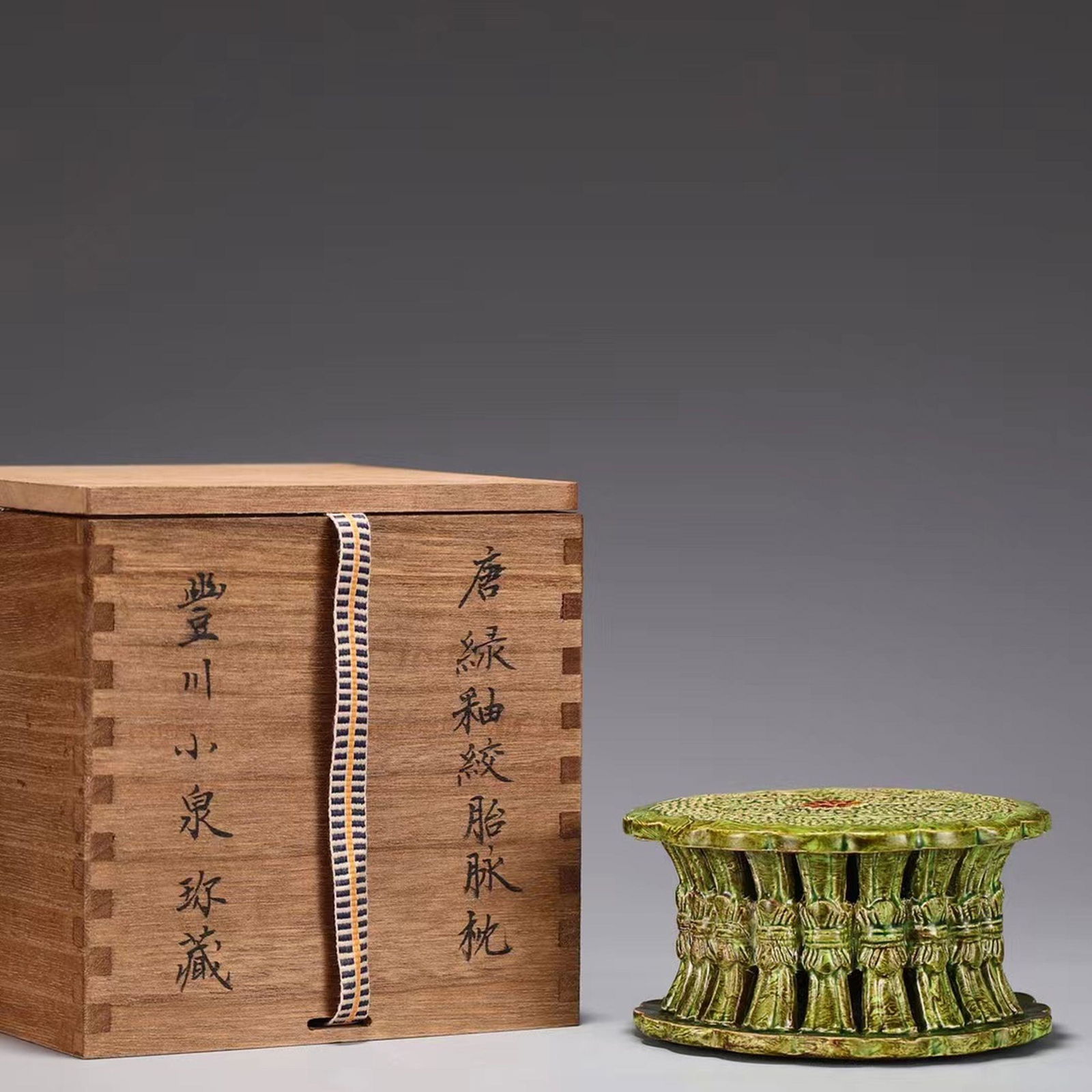 A Round Green Glazed Pillow (1 of 9)