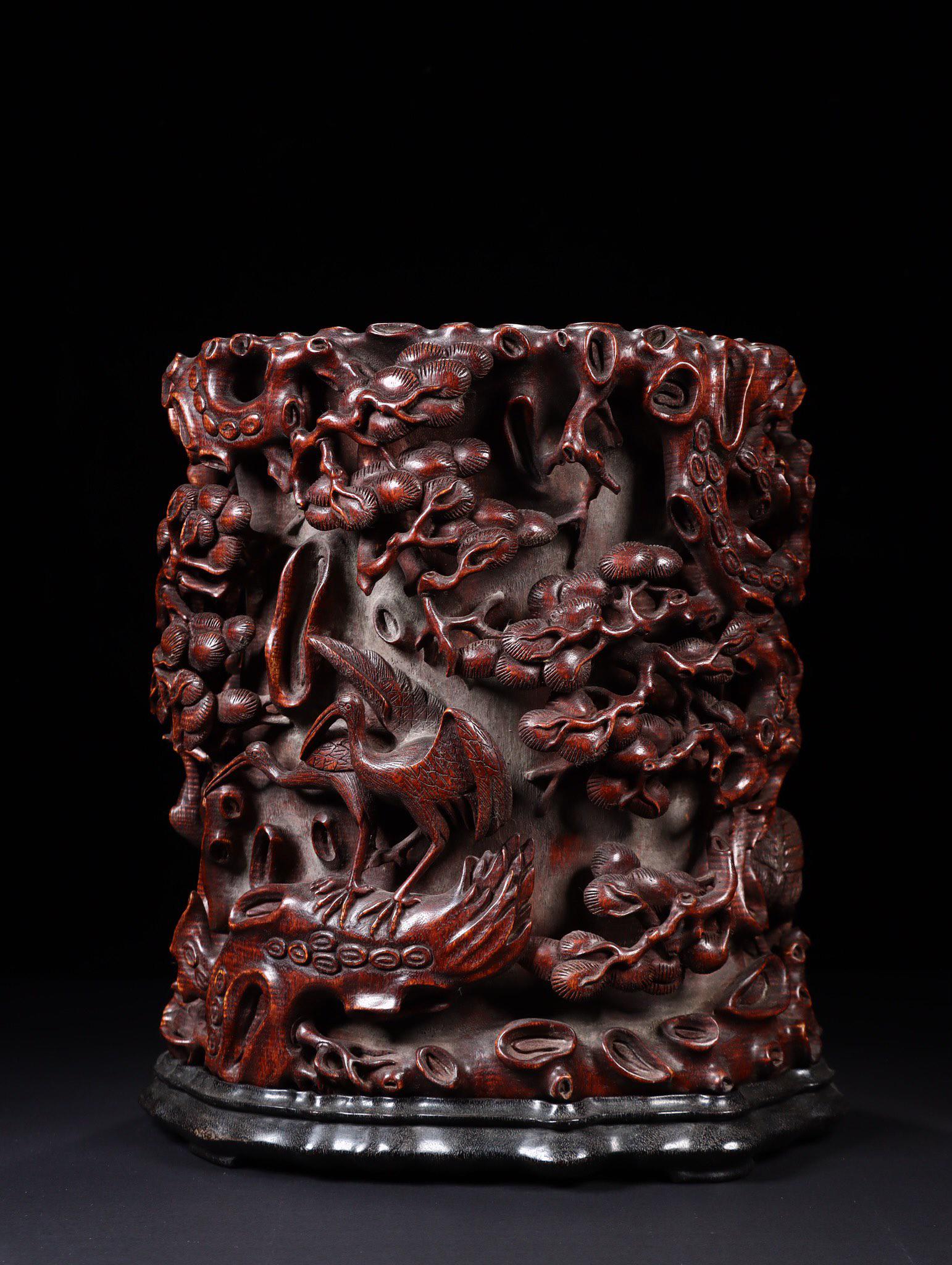 A Carved Agarwood Brushpot: A Carved Agarwood Brushpot. Height: 35cm Width: 29cm Weight: 3945g