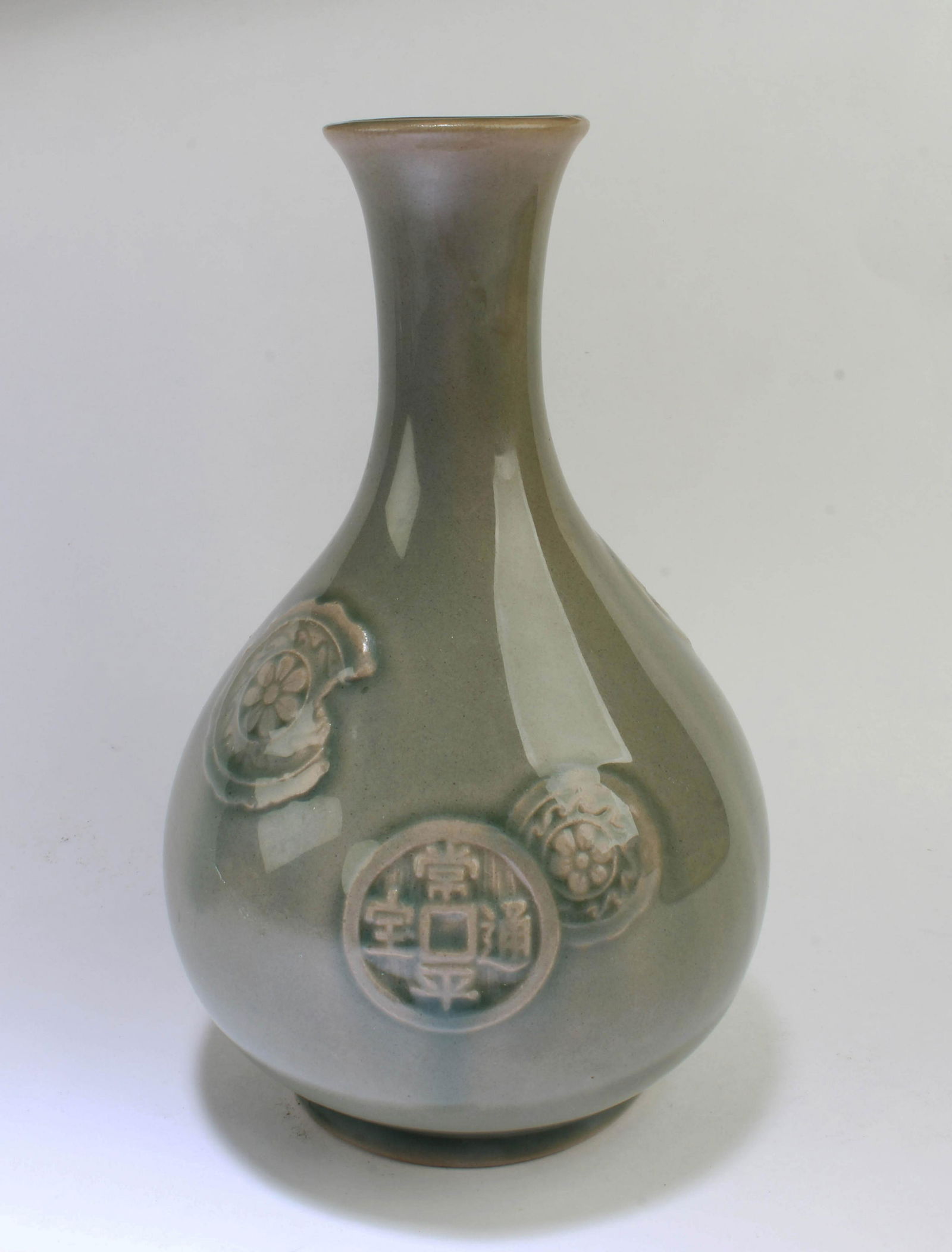 A Korean Celadon Vase: A Korean Celadon Vase. Height: 7"
