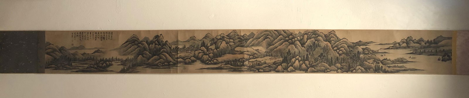 Chinese Hand Scroll Painting: Ink nd color on paper, depicting a mountain landscape scenery, signed with seal attributed to Wang Hui. Length: 91.5" Height: 9.5"
