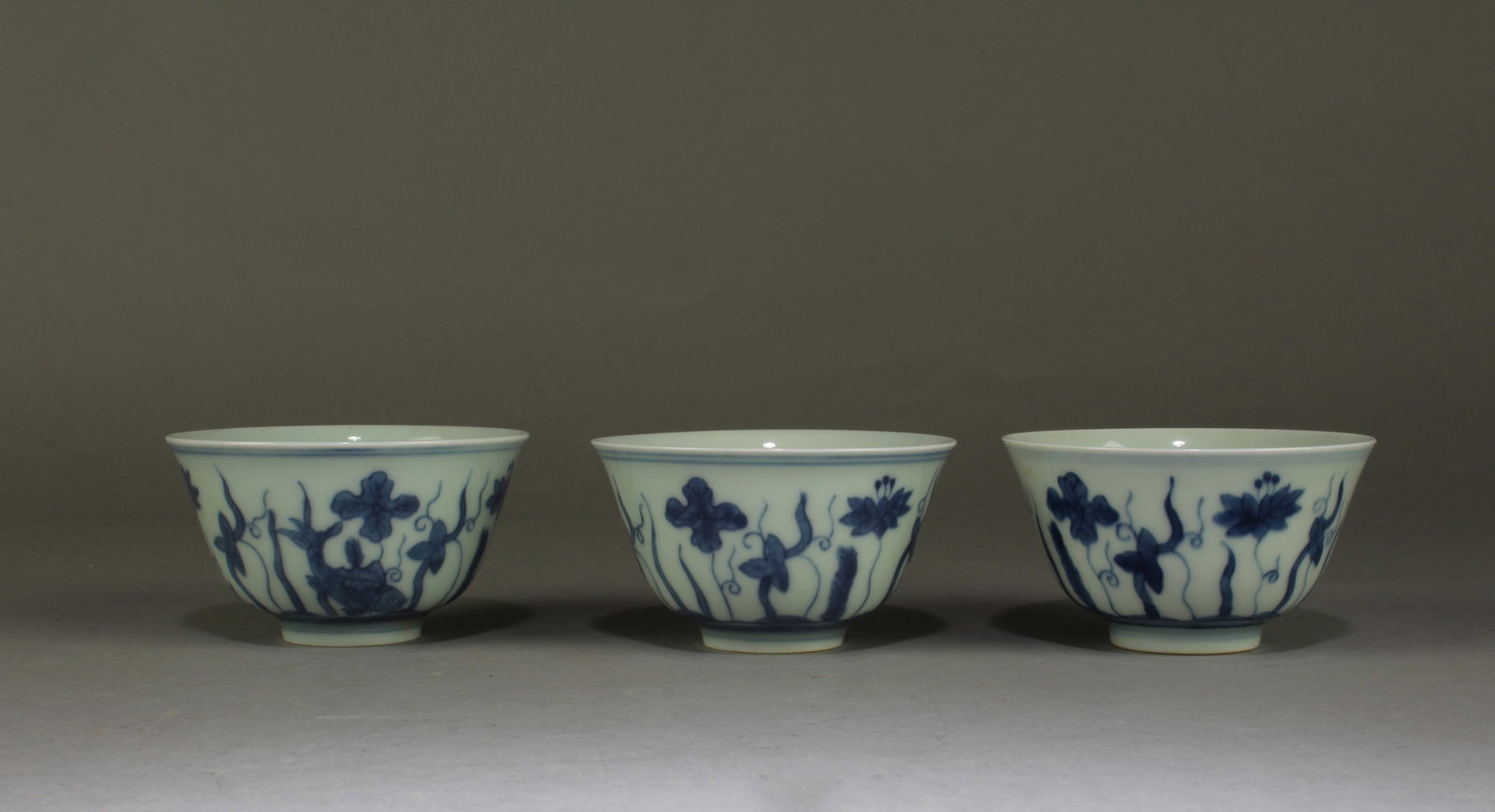 A Group of Three Blue & White Porcelain Cups: A Group of Three Blue & White Porcelain Cups. Diameter: 3.25"