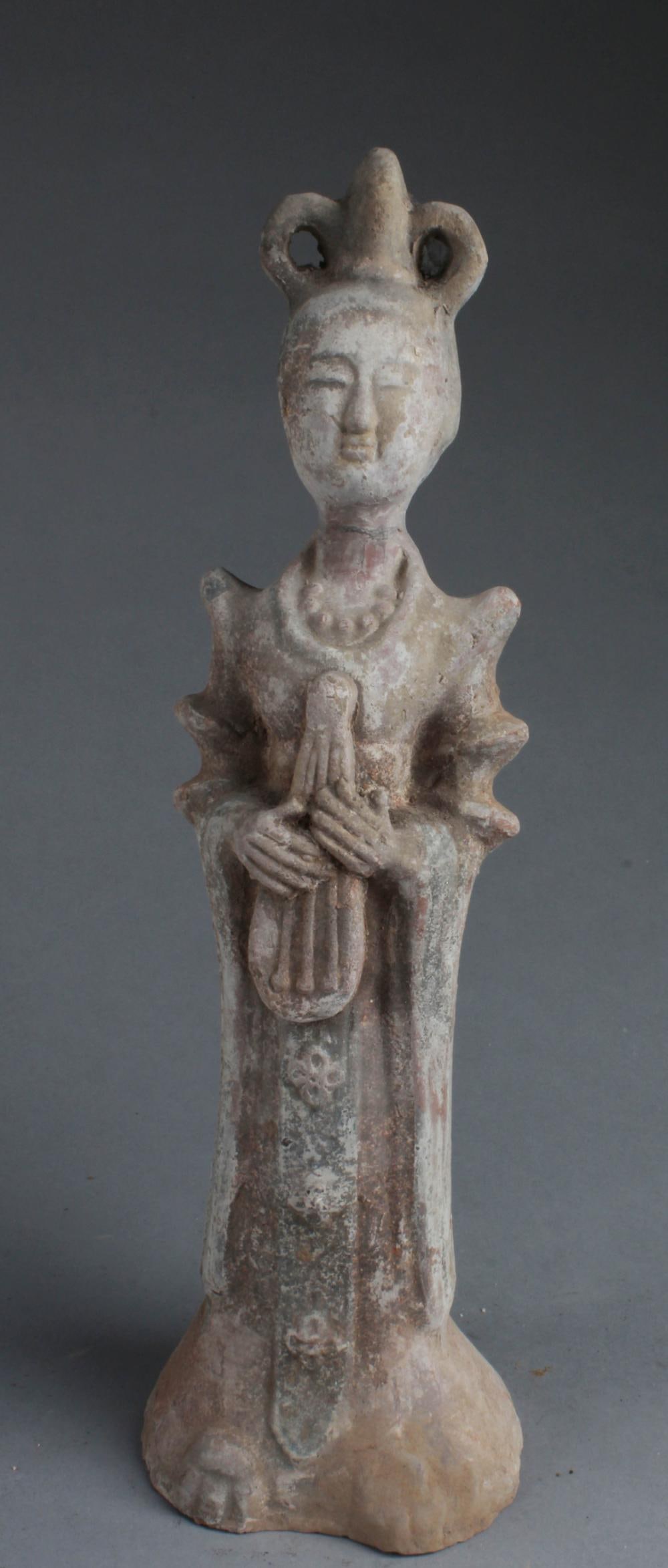 A Chinese Female Musician Pottery Figurine: A Chinese Female Musician Pottery Figurine, holding a musical instrument. Height: 15.5"