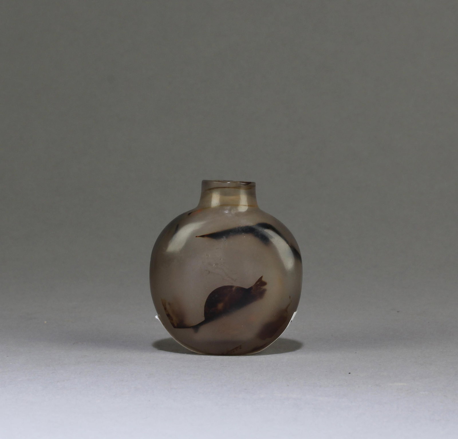 A Qing “clever-carved?? snuff bottle (1 of 5)