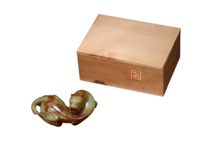 A Russet and Celadon Jade Chi-Dragon Carving