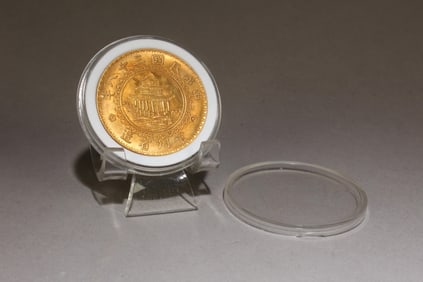 A Chinese Silver Inlaid Gold Coin