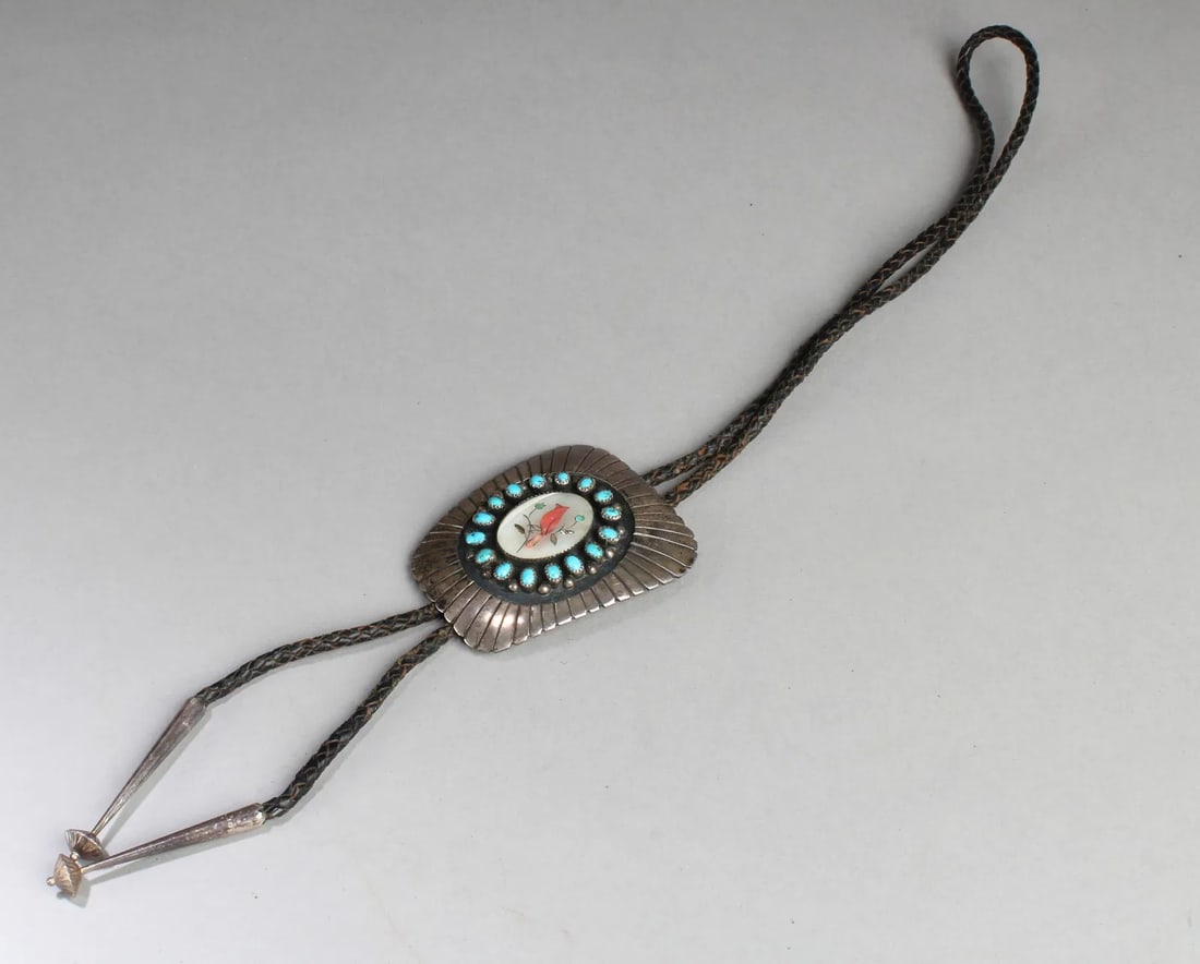 A Silver with Turquoise Stone Accessory: A Silver with Turquoise Stone Accessory. Length: 3"