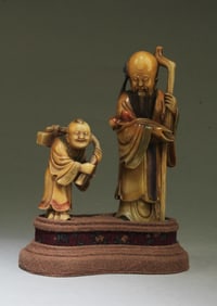 A Group of Two Soapstone Statues