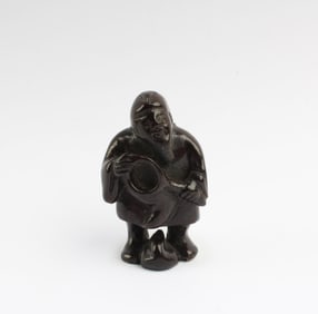 A Carved Wooden Figurine