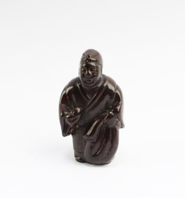 A Carved Wooden Figurine