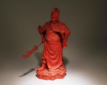 A Cinnabar Guanyu Statue