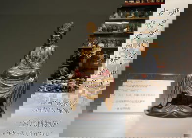 A Gold Pasted Wood Sitting Guanyin