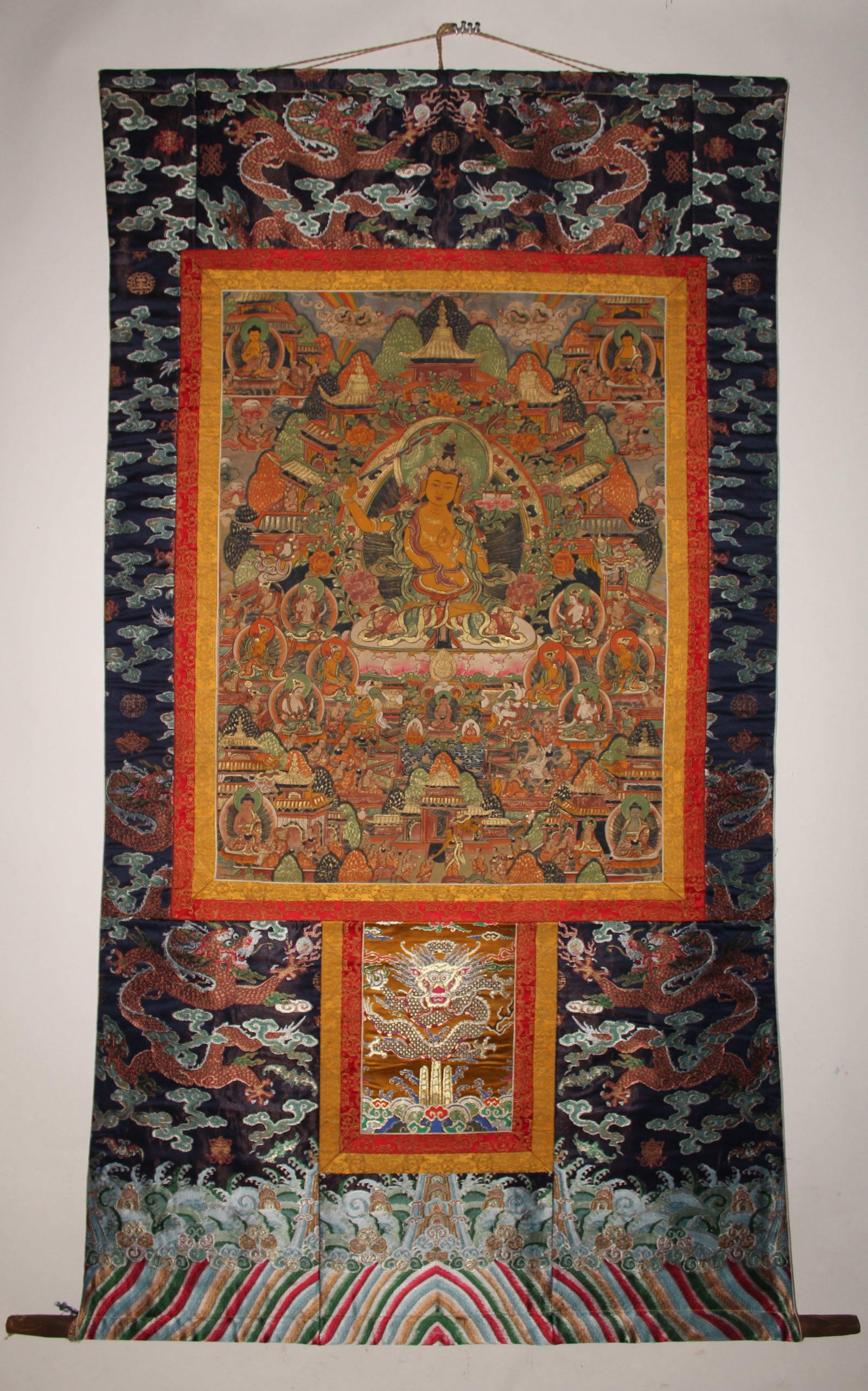 A Tibetan Thangka: A Tibetan Thangka. Outer Dimension: 71" x 36", Inner Dimension: 24" x 34".