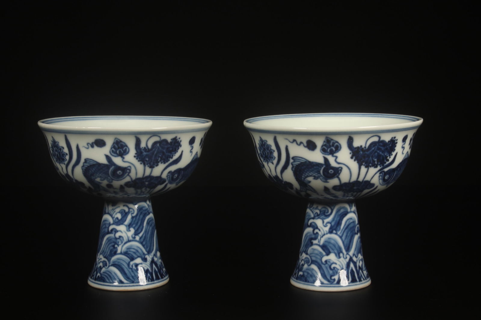 A Pair of Blue and White Stem Cups: A Pair of Blue and White Stem Cups. Dimensions: 3.5" x 3.5".